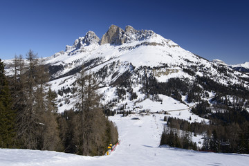 Fototapeta na wymiar Costalunga pass and Rotewand view from a steep ski run