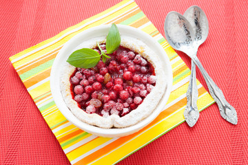 red currant pudding in white baking dish, berry pie
