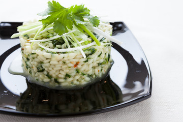risotto with spinach on a platter