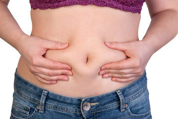 Naklejka premium Woman measuring her belly fat