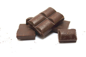 Broken chocolate bar on a white background