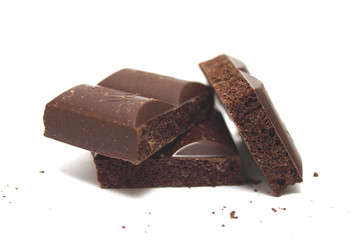 Broken chocolate bar on a white background