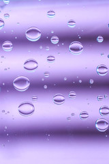 Water drops on purple