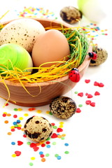 Obraz na płótnie Canvas Colorful Easter eggs and cake decorations.