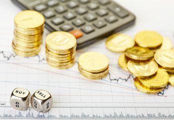 Downtrend stacks of golden coins, dices cubes with the words SEL