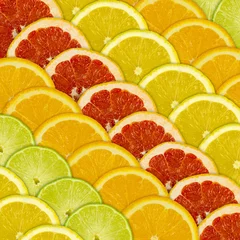 Fotobehang Abstracte achtergrond van verschillende citrusvruchten © macrowildlife