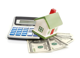 house sitting with a calculator and dollar