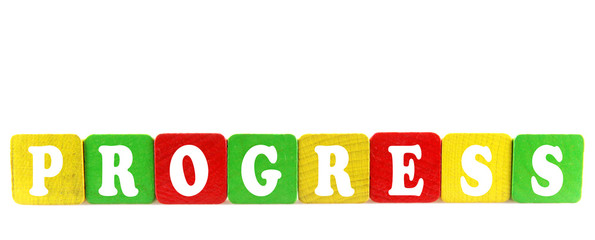progress - isolated text in wooden building blocks