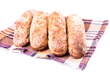 Freshly baked bread rolls with sesame