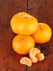 Tasty mandarines  on wooden background