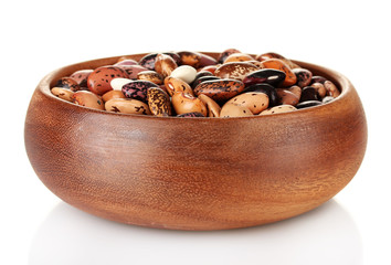 Wooden bowl with beans isolated on white