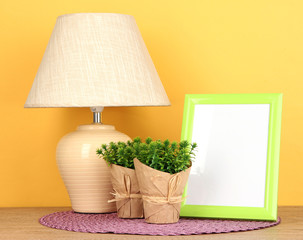 Colorful photo frame, lamp and flowers