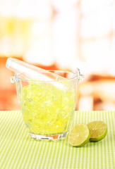 Ice in the bucket on bright background