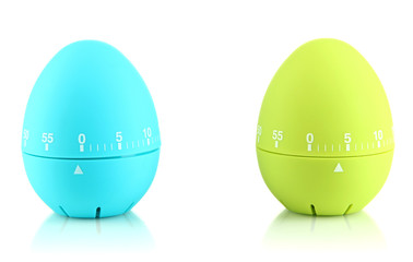 Blue and green egg timers, isolated on white
