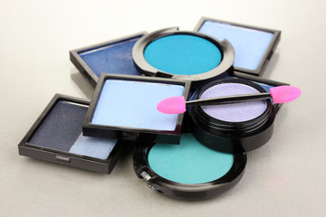 Bright eye shadows and sponge brushes for foundation