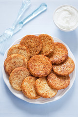 Mini pancake and sour cream, selective focus