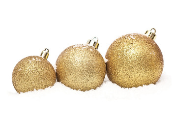 gold christmas balls with snow isolated on white
