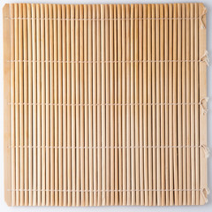 Bamboo mat for sushi. Straw colored background