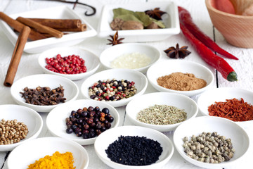 Spices and dried vegetables on vintage white planks