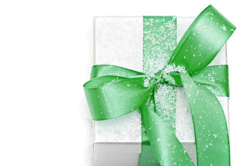 White gift box, green bow on white background