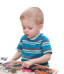 the two-year-old child collects a puzzle isolated,