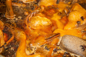 Fototapeta na wymiar Boiling duck stewed in the gravy sauce in the pot