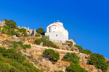 Fototapeta na wymiar Small white church on the coast of Crete in Greece