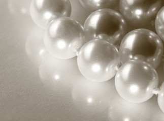 White pearl on reflective surface