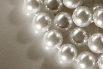 White pearl on reflective surface