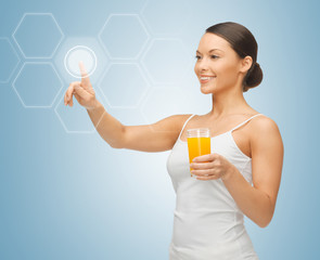 woman with glass of juice and virtual screen