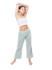 Fototapeta premium Attractive healthy young woman stretching gym, isolated on white