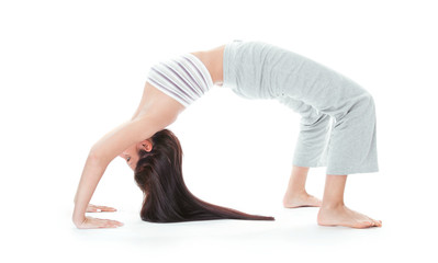 Fototapeta na wymiar Attractive healthy young woman stretching gym