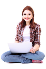 Naklejka premium Beautiful young woman with laptop isolated on white