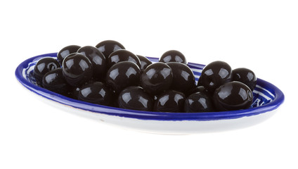 Olives black watered with olive oil in a bowl isolated on a whit