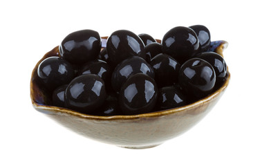 Olives black watered with olive oil in a bowl isolated on a whit