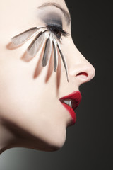 Beautiful woman profile with bird feathers © Kanea