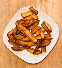 Oven baked potato chips on a white plate