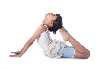 Little girl practicing yoga