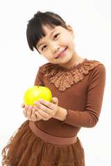 Cute asian kid with an apple