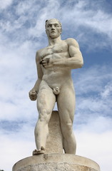 Fototapeta na wymiar Statue of a runner in the Marble Stadium of Rome, Italy