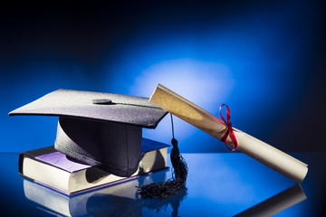 Graduation hat, Diploma and book