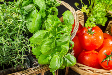 Fresh vegetables and herbs in a basket