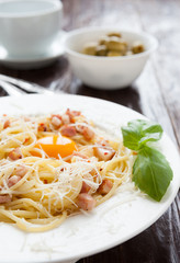 Spaghetti carbonara with egg yolk in the middle