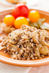 buckwheat with mushrooms and pickled tomatoes