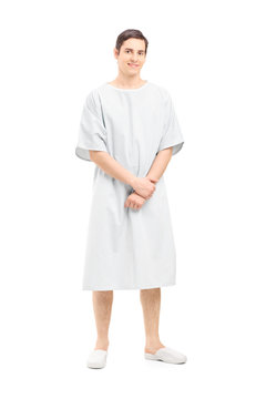 Full Length Portrait Of A Male Patient In A Hospital Gown