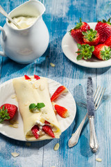 Pancakes with strawberries and whipped cream