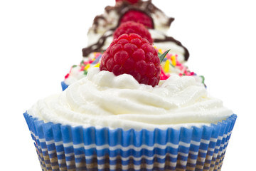 chocolat muffin whit whipped cream and rapsberry