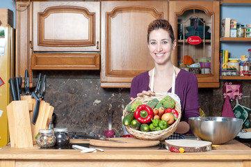 beautiful housewife with basket of vegetables