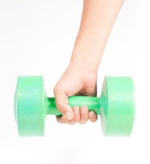green dumbbell in hand isolated on white