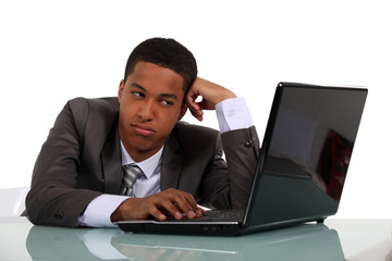 Bored businessman sat at his desk